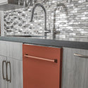 ZLINE 24 in. Top Control Dishwasher with Copper Panel and Traditional Style Handle, 52dBa (DW-C-H-24) built-in to modern grey cabinets in a luxury kitchen.