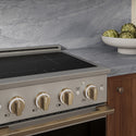 ZLINE Autograph Edition 24 in. 3.2 cu. ft. Marino Induction Range with 3 Element Cooktop and Electric Convection Oven in Stainless Steel with Champagne Bronze Accents (MINRZ-24-CB)