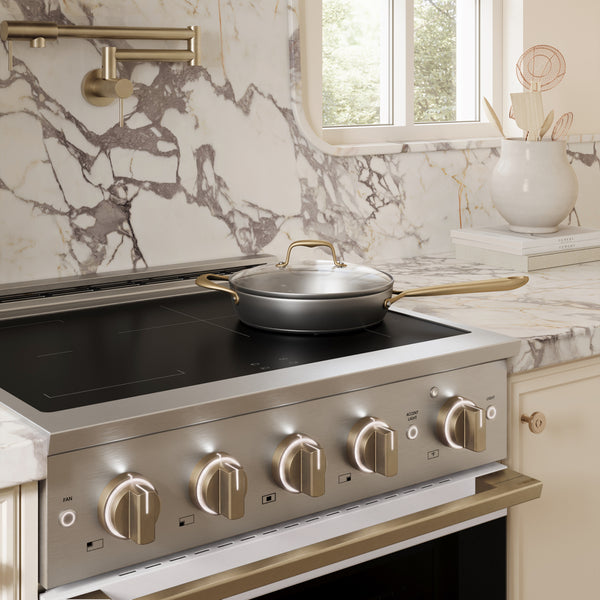ZLINE Autograph Edition 30 in. 4.2 cu. ft. Marino Induction Range with 4 Element Cooktop and Electric Convection Oven in Stainless Steel with White Matte Door and Champagne Bronze Accents (MINRZ-WM-30-CB)